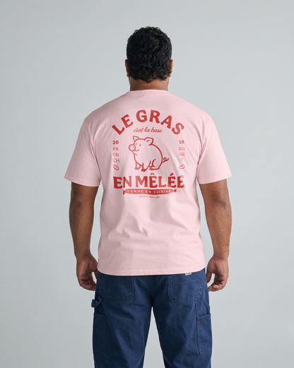 T-shirt rugby rose pâle avec illustration de cochon et texte rouge "Le gras c'est la base en mêlée".
