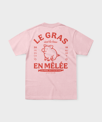 T-shirt rugby rose pâle avec illustration de cochon et texte rouge "Le gras c'est la base en mêlée".