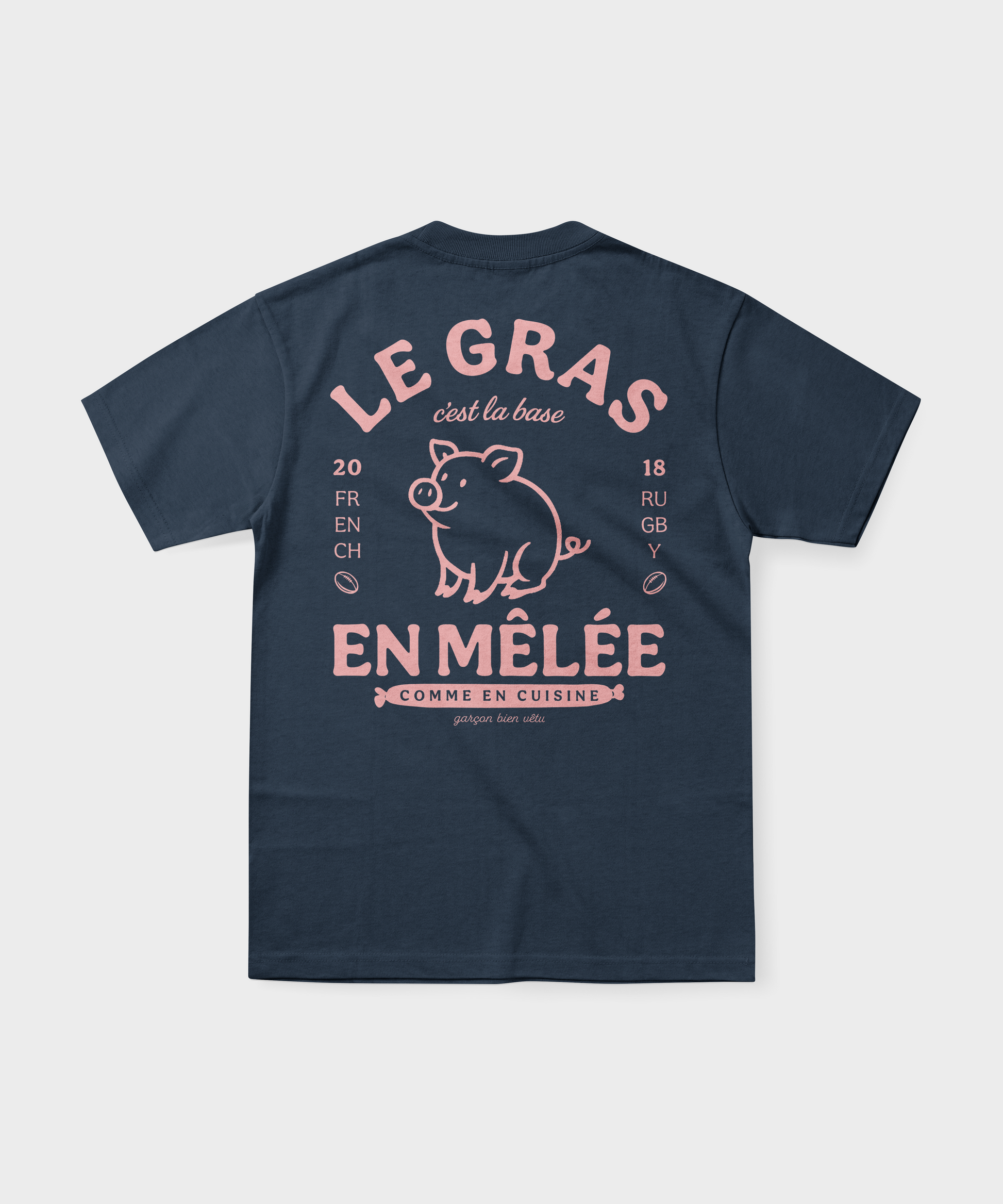 T-shirt rugby bleu marine avec illustration de cochon rose et texte "Le gras c'est la base en mêlée".